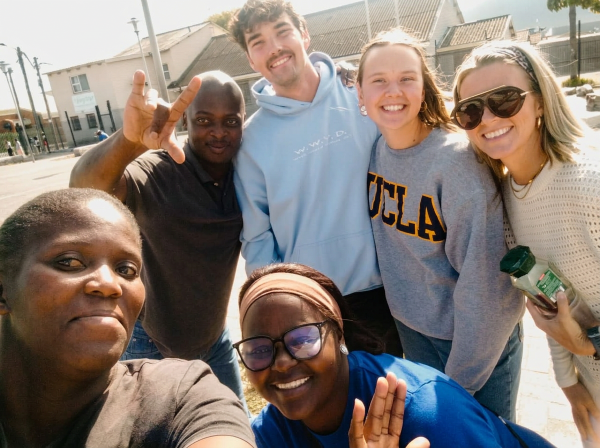Friends posing for a selfie together outdoors